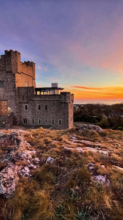 The sun setting behind Roch Castle in Wales.