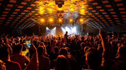 Revellers enjoying dancing at a music venue and ballroom