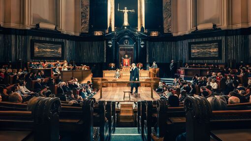 Actors in legal costume ready to perform a play in front of an audience