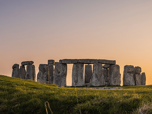 Landscape view of the Stonehenge monument at sunset
