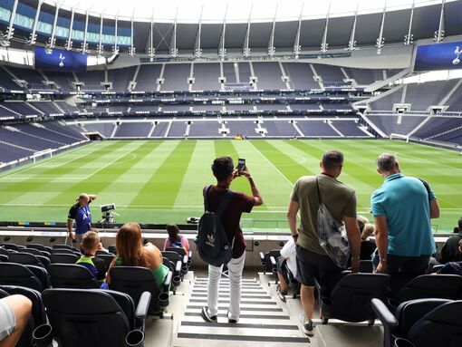 A crowd of visitors to Tottenham Hotspurs' home ground photograph the amazing stadium