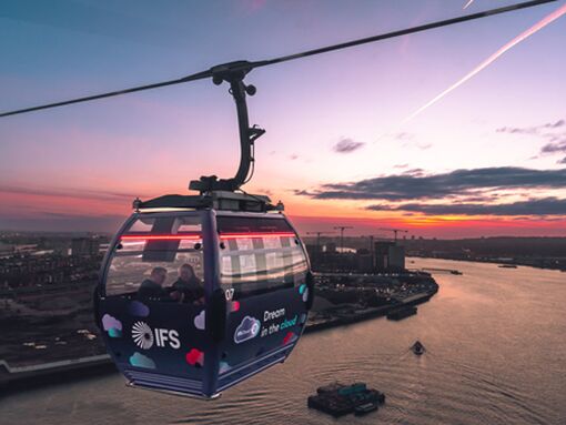 The IFS Cloud Cable car travels over east London during a beautiful sunset