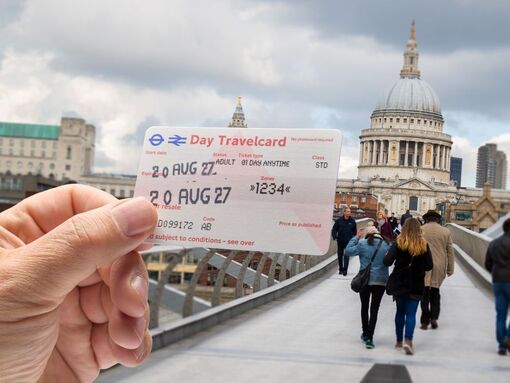 London Day Travelcard being held up outside St Paul's Cathedral