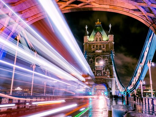 Zooming across Tower Bridge at night