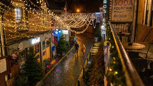 Edinburgh street illuminated during Christmas time