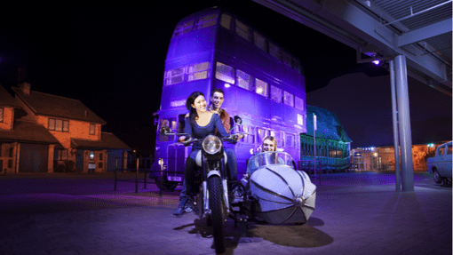 Family posing on backlot motorbike and sidecar at Warner Bros Studio Tour