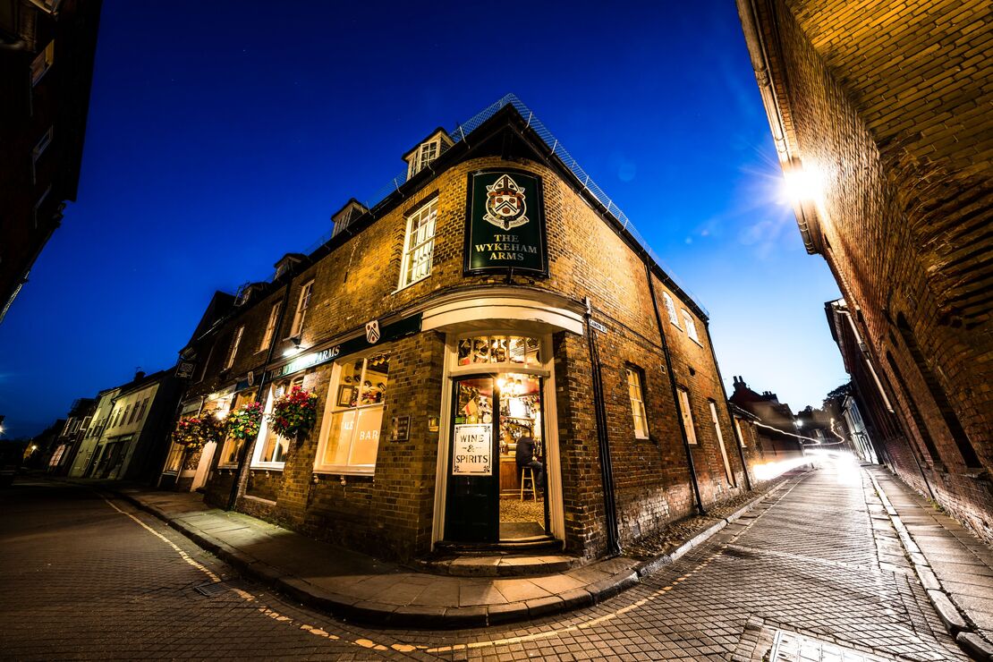 The narrow streets of the city at night. Historic buildings