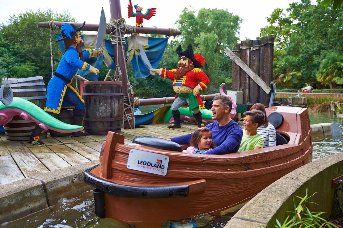 A family enjoying the Pirate Falls ride at LEGOLAND® Windsor Resort