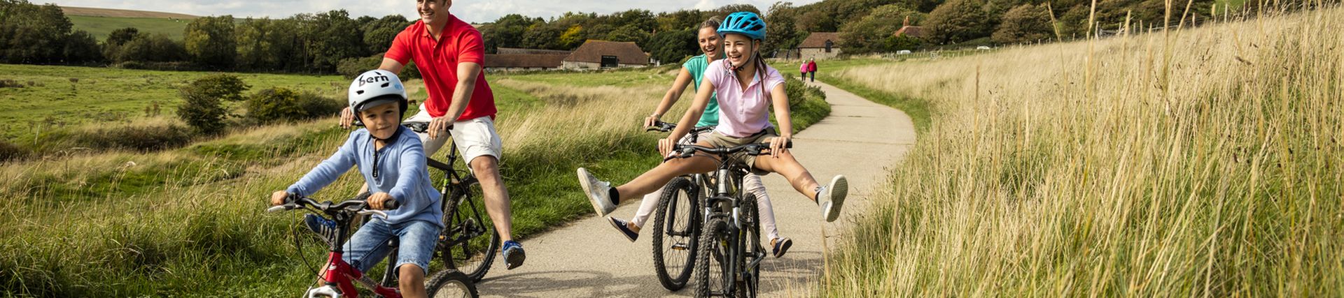 a_family_riding_bicycle_in_the_countryside_in_summer