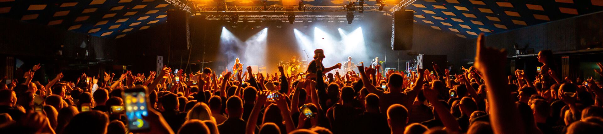 Revellers enjoying dancing at a music venue and ballroom