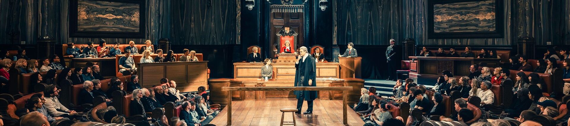 Actors in legal costume ready to perform a play in front of an audience