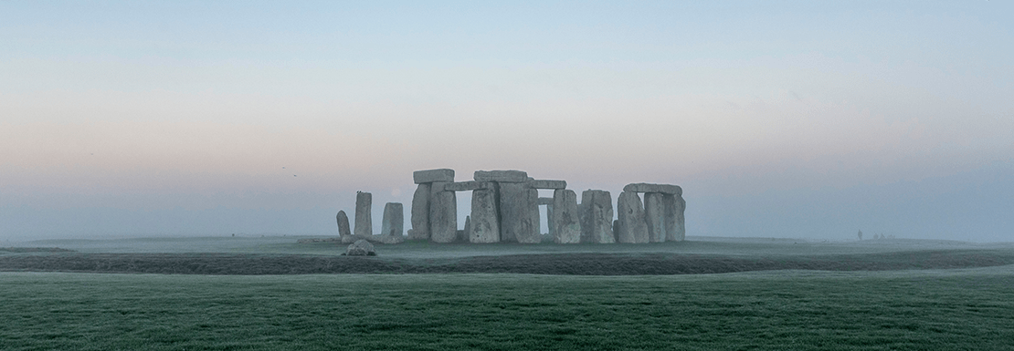 landscape view of Stonehenge monument on a foggy evening
