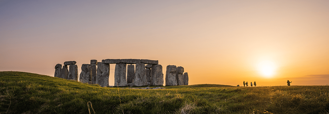 Landscape view of the Stonehenge monument at sunset