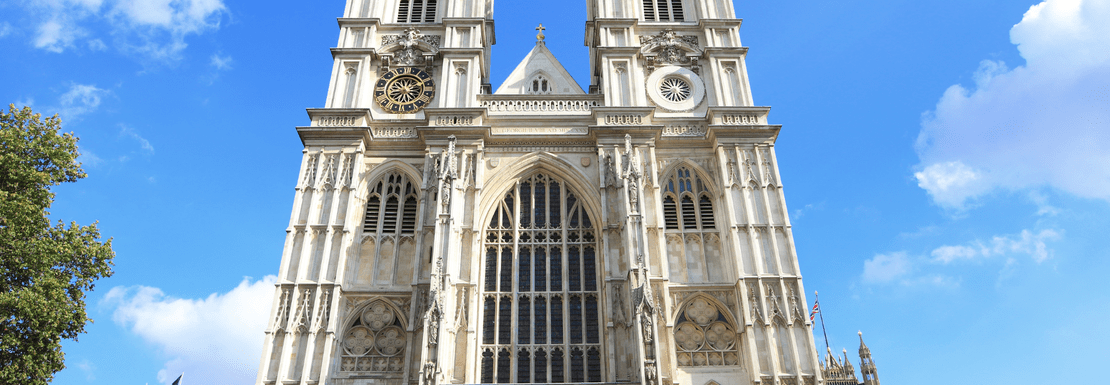 front view of the Westminster Abbey facade against blue sky