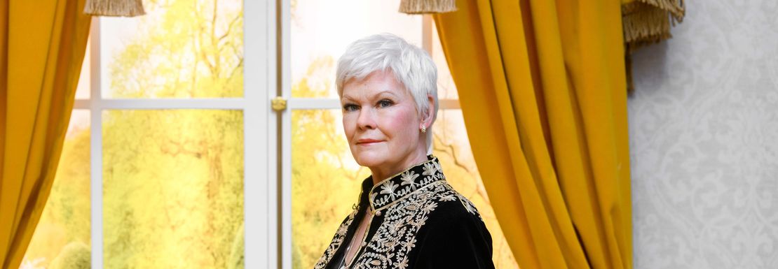 Judi Dench at Madame Tussauds dressed in a coronation outfit