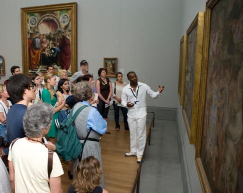 A guide addressing a group of participants in the Official National Gallery Highlights Tour (1) _ Golden Tours