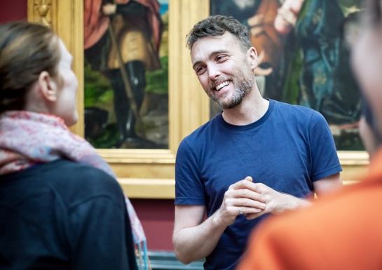 A guide addressing a group of participants in the Official National Gallery Highlights Tour (7) _ Golden Tours