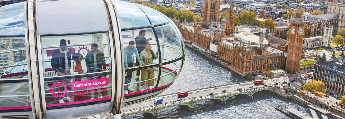 A view of a glass capsule on the London Eye as it soars above the city and the River Thames