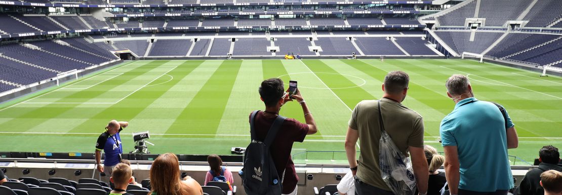 A crowd of visitors to Tottenham Hotspurs' home ground photograph the amazing stadium