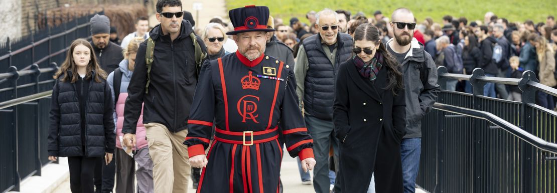 Yeoman Warder leading a tour of visitors at the Tower of London