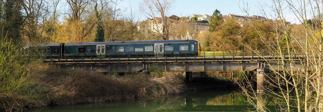 BritRail London Plus M-Pass _ ACP _ Bradford-up-on-Avon _ A train on a bridge over the river Avon at Bradford-up-on-Avon