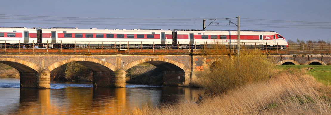 Train over a bridge near Newark that you can get on using the BritRail GB M-Pass