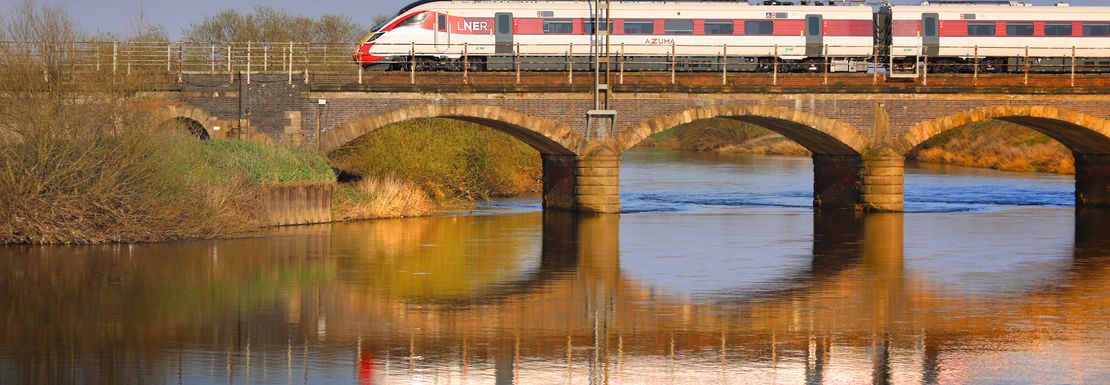Train over a bridge near Newark that you can get on using the BritRail GB M-Pass
