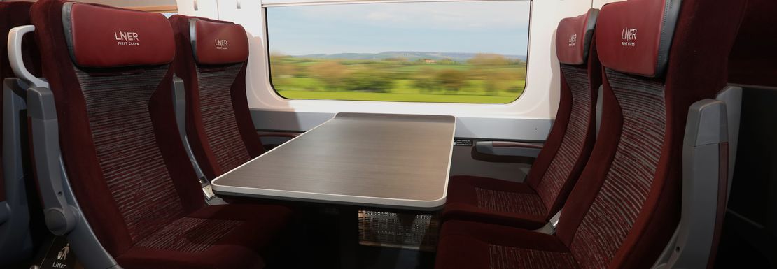 Comfortable seats with table inside a LNER London Northern Eastern Railway train