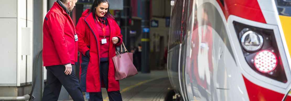 Accessibility Staff next to a London North Eastern Railway train