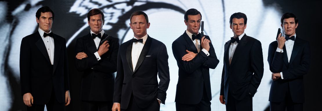 Wax figures in tuxedos of all James Bond actors