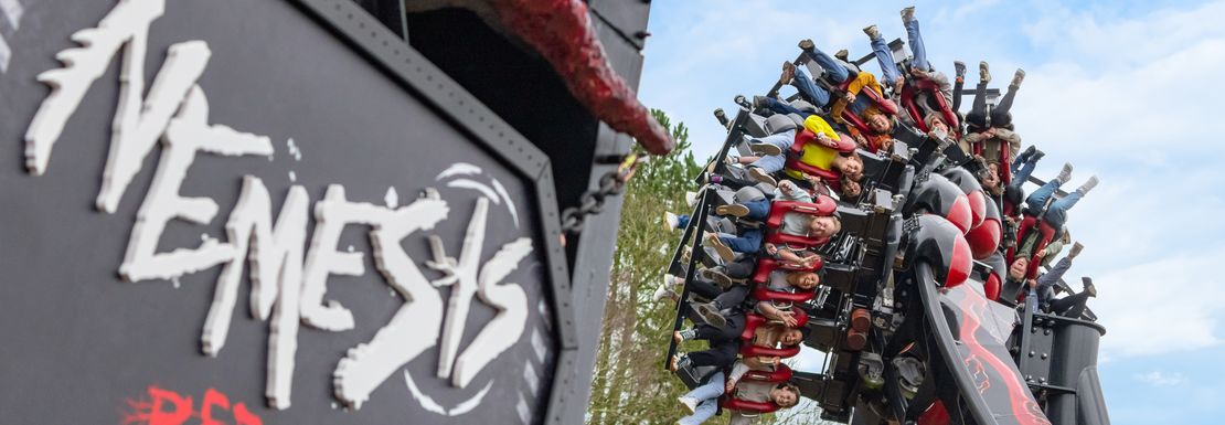 The Nemesis Reborn roller coaster twists ride goers upside down at a great height