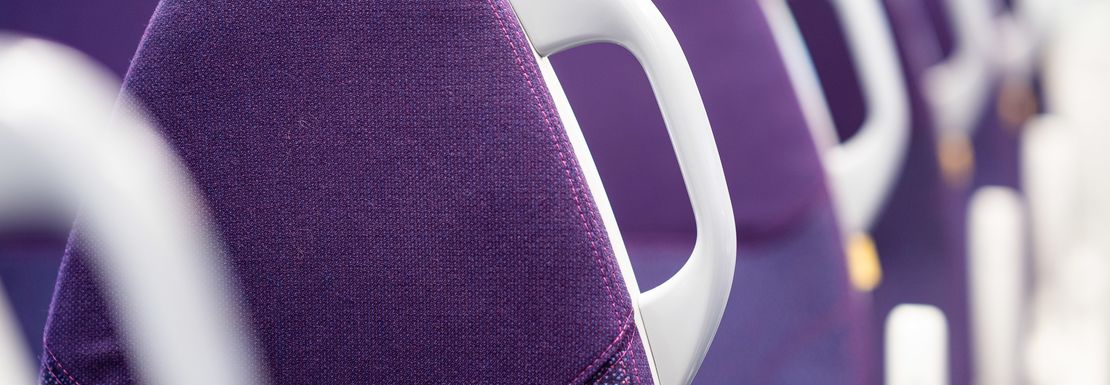 Comfortable Heathrow Express train seats in purple