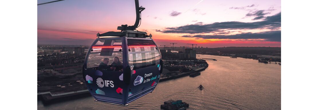The IFS Cloud Cable car travels over east London during a beautiful sunset