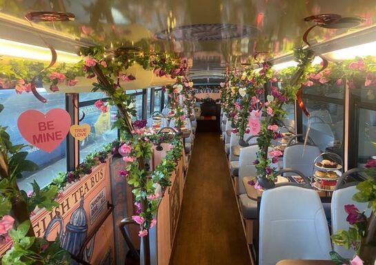 Afternoon tea bus decorated with roses up and down the top deck
