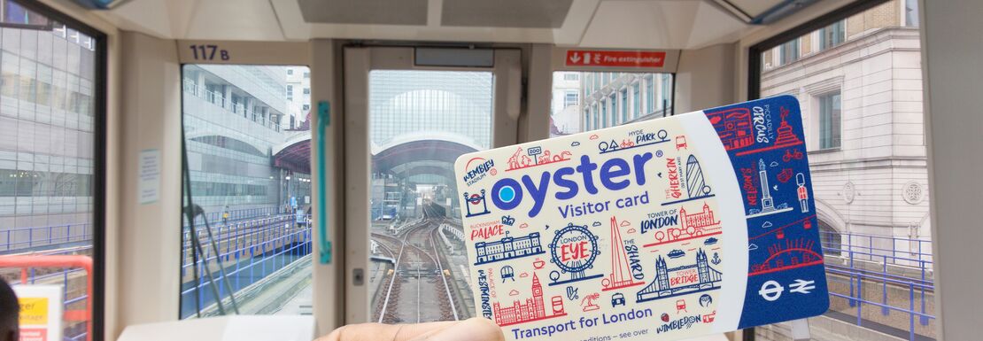 A passenger travels on London's DLR with a a Visitor Oyster Card
