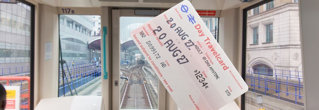 A single London Day Travelcard inside a London transport DLR train