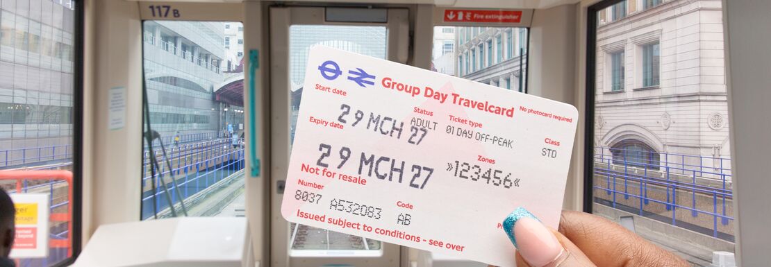 Group Day Travelcards being used on London transport in a DLR train