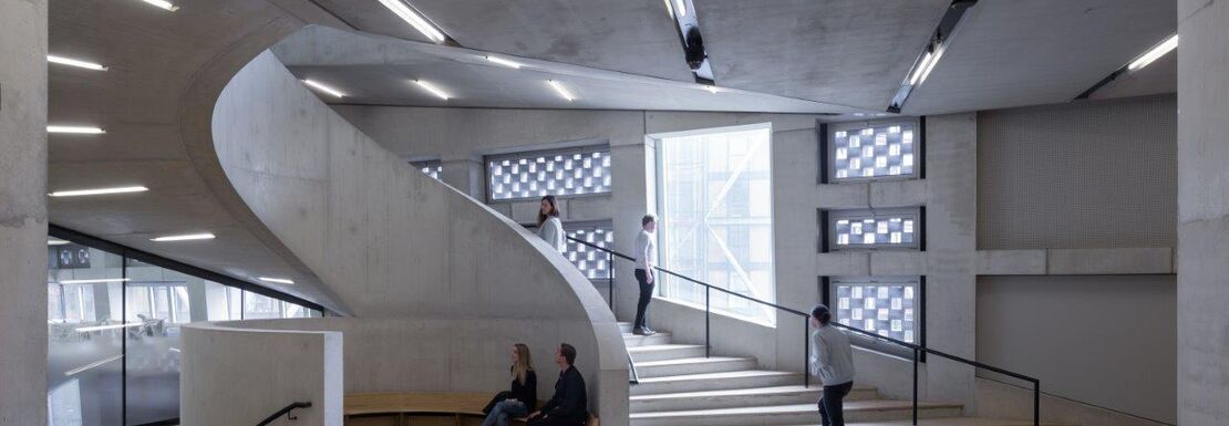 The grand inside of the Tate Modern includes a swerving white stairway