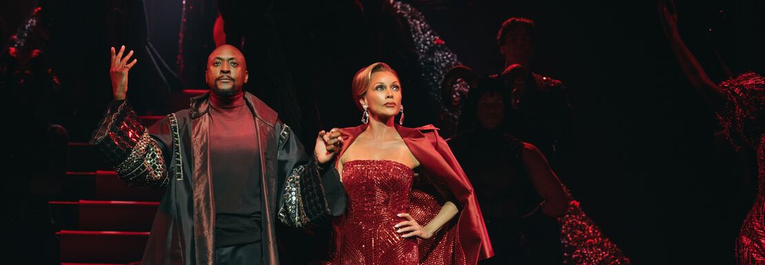 Nigel and Mirand in a red dress