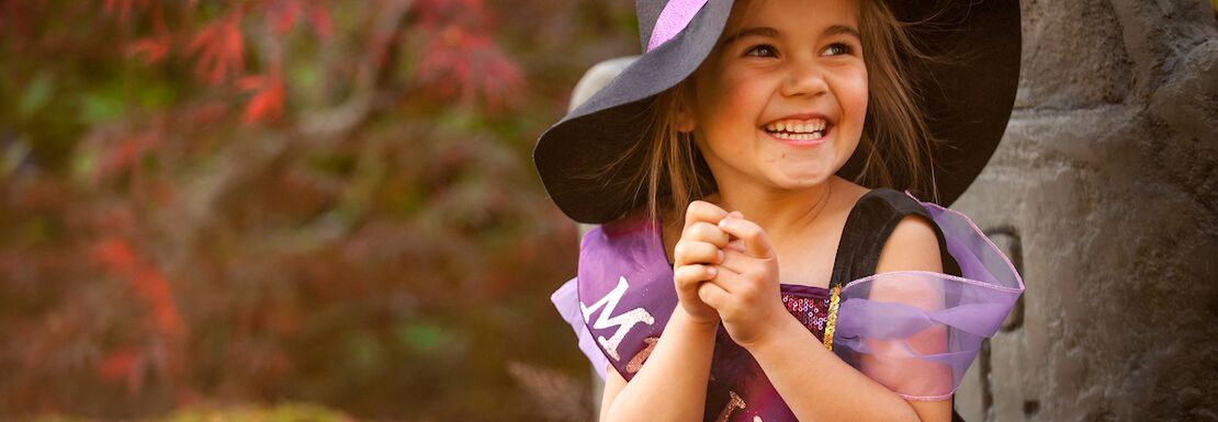 A child guest dressed as a witch at Howloween at Chessington