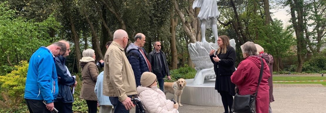 Group of visitors having an accessible Strawberry Field garden tour