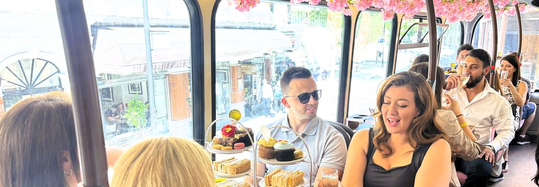 Guests enjoying afternoon tea on a bus tour