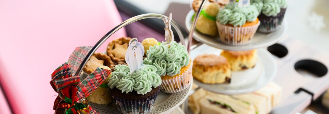 Plates of cakes, scones and sandwiches