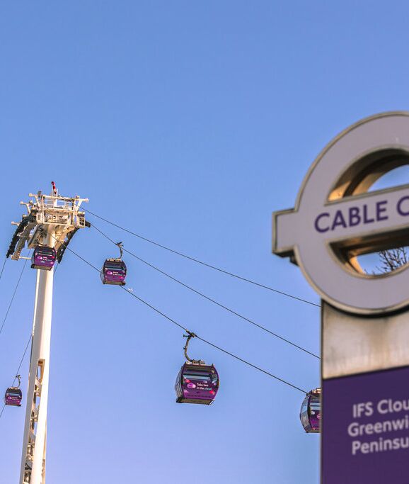 The IFS Cable Car sign with cars running in the background