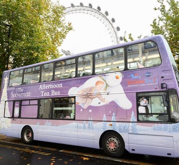 Snowman bus with London Eye in background