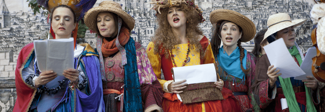 People dressed in period costume at the Globe Theatre