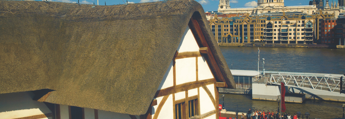 The exterior of the Globe Theatre with its thatched roof