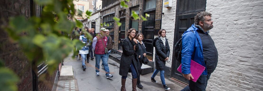 Tour group walking around Goodwins Court