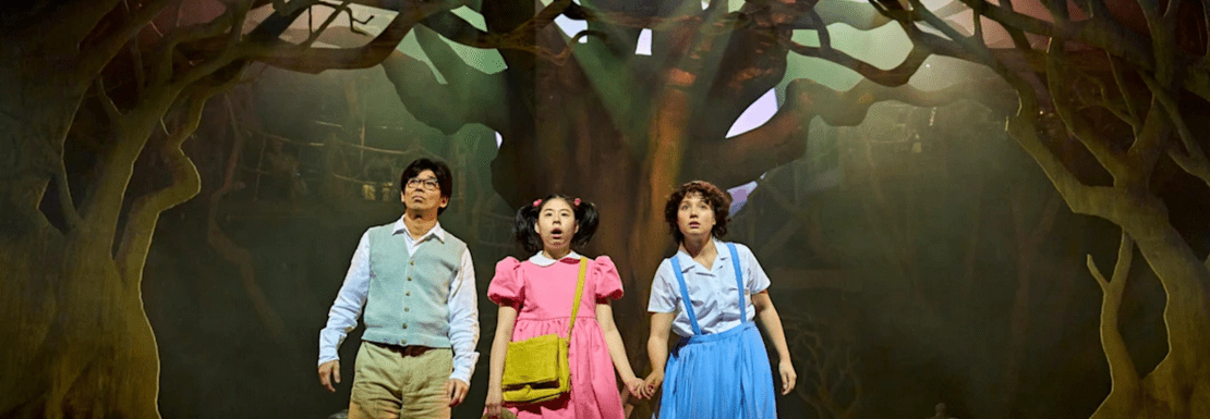 Actors in an atmospheric wood in the My Neighbour Totoro stage show