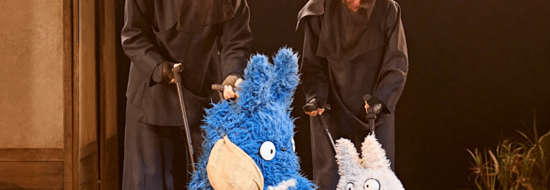 Actors on stage with puppets in the My Neighbour Totoro stage show